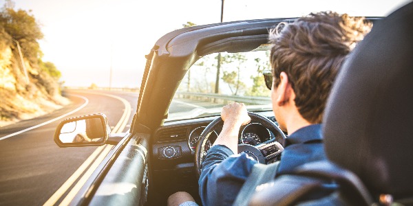 Couple on convertible car