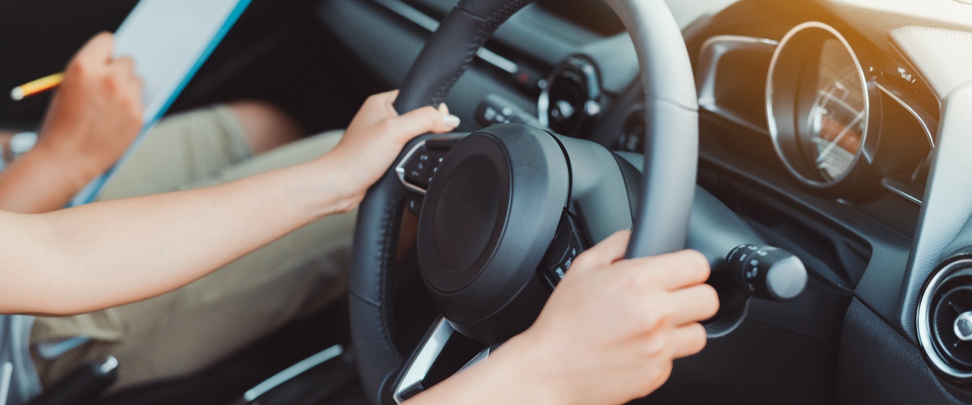 Woman practice driving car exam driver licence control steering wheel education and learn on street road by driving instructor teaching at school drive transportation safety travel, people lifestyle